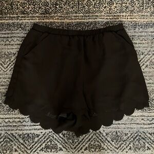 Black Flowy Shorts with Side Pockets and a Scalloped Hem (Size Medium)